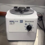 Drucker Diagnostics 614B Centrifuge With Blue Tube Inserts. Fixed Price $75.00.