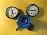 Compressed Gas Regulator W/2GAUGES Used Sec Norgren 11-010. Fixed Price $7.77.